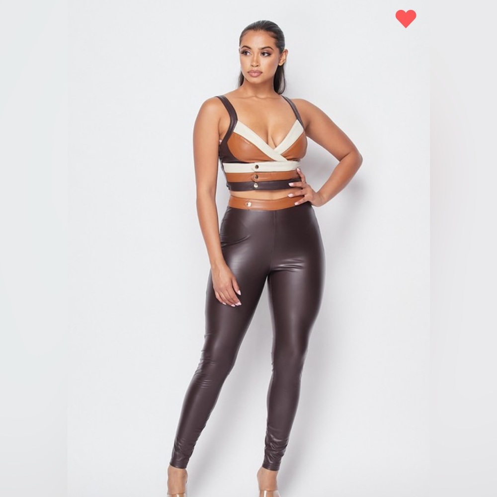Two-piece crop top faux leather pants set.